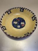 A Scottish Bough pottery fruit bowl decorated with cherries and blossom with floral style and linear