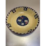 A Scottish Bough pottery fruit bowl decorated with cherries and blossom with floral style and linear