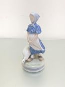 A Royal Copenhagen porcelain figure, The Goose Girl, decorated with polychrome enamels, (h 24cm x