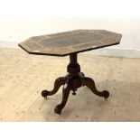 A Victorian rosewood and walnut and satinwood octagonal inlaid centre table, raised on a turned