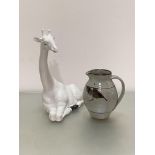 A seated white ceramic Italian novelty giraffe figure (h46cm) and a Kailzean pottery jug decorated