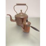 An extremely large Edwardian copper and brass mounted kettle with acorn style finial and loop handle
