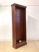 A late 20th century mahogany floor standing bookcase, with projecting cornice and reeded moulding