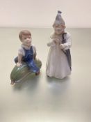 A Royal Copenhagen figure of a boy in his nightgown with umbrella, (h 16cm x 8cm) and a Royal