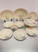 A Clarice Cliff Newport Pottery handpainted Deco 1930's part dinner service including two ashet's,