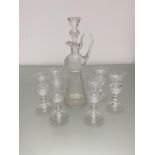 A crystal thistle shaped liquor decanter and a set of six matching glasses, all decorated with