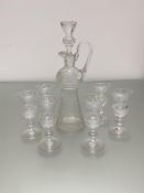 A crystal thistle shaped liquor decanter and a set of six matching glasses, all decorated with