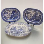 A pair of blue and white china ashet's decorated with three men on a bridge, (40cm x 32cm), one with