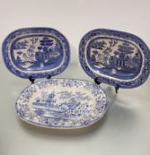 A pair of blue and white china ashet's decorated with three men on a bridge, (40cm x 32cm), one with