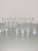 A set of six crystal slice cut tumblers, (h 11cm), a set of six crystal slice cut hock glasses (h