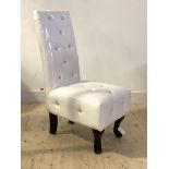 A Contemporary bedroom chair, upholstered in diomonte studded white faux leather, raised on ebonised