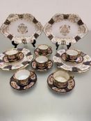 A set of four Wedgwood 1900/1920's cake plates with gilt centre panel and rose and floral sprays