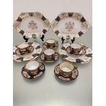 A set of four Wedgwood 1900/1920's cake plates with gilt centre panel and rose and floral sprays