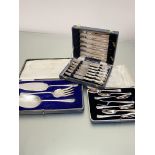 A set of three Epns fish servers, a set of six Epns fruit knives and forks in fitted case by