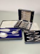 A set of three Epns fish servers, a set of six Epns fruit knives and forks in fitted case by