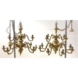 A pair of gilt brass Dutch style chandeliers, each with ceiling rose, chain and twelve scrolled