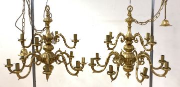 A pair of gilt brass Dutch style chandeliers, each with ceiling rose, chain and twelve scrolled