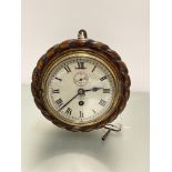 An Edwardian oak rope pattern bordered wall clock by Dent, 4 Royal Exchange London, with enamel dial