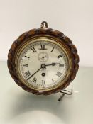 An Edwardian oak rope pattern bordered wall clock by Dent, 4 Royal Exchange London, with enamel dial