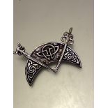 An Iain MacCormack, Iona silver crescent Celtic brooch, stamped verso INC Iona, (6cm x 4cm)