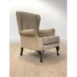 A Georgian style upholstered wing chair, first half of the 20th century, H100cm, W80cm. D78cm