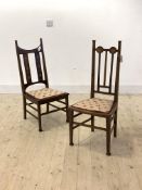 A matched pair of Edwardian inlaid mahogany side chairs with spar back, upholstered seat and