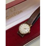 A lady's Omega 9ct gold manual wristwatch with baton hour markers, on leather strap (d.2cm),