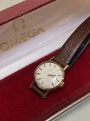A lady's Omega 9ct gold manual wristwatch with baton hour markers, on leather strap (d.2cm),