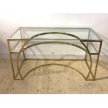 A contemporary gilt metal and glass two tier desk, H76cm, W141cm, D70cm