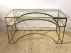 A contemporary gilt metal and glass two tier desk, H76cm, W141cm, D70cm