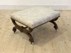 A Victorian walnut framed footstool by John Taylor & sons, Edinburgh, the top upholstered in