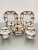 A Spode Copeland china tea service including two cake plates, milk jug, sugar bowl, seven cups and