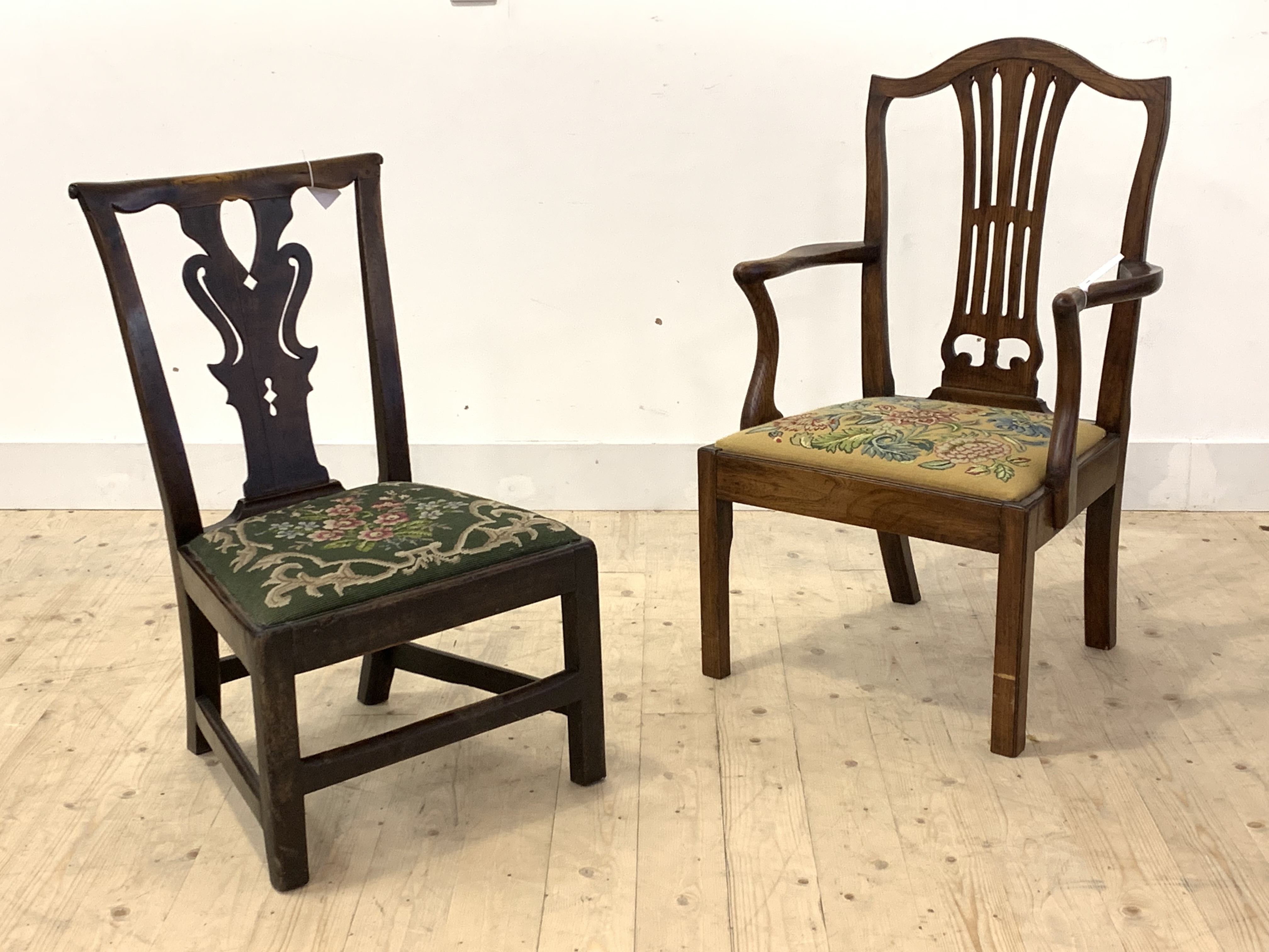 An 18th century vernacular elm side chair, with scrolled crest rail over pierced splat and drop in