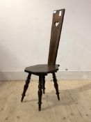 A Late 19th/ early 20th century walnut spinning chair, the pierced back with simulated inlay, raised