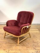 Ercol, a light beech and elm lounge easy chair, with hoop and spindle back and arms, fitted