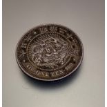 A Japanese one Yen coin 416900 with dragon design (d 4cm)