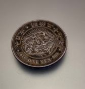 A Japanese one Yen coin 416900 with dragon design (d 4cm)