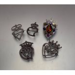 Three various white metal Black and Booth style brooches and two silver brooches including a semi-