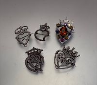 Three various white metal Black and Booth style brooches and two silver brooches including a semi-