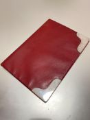 A red Moroccan Asprey of London leather blotter with silver mounts, stamped Asprey to inside