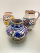 A Poole pottery baluster handpainted jug with stylised floral band, impressed mark verso Carter