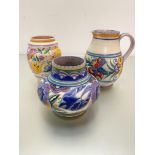 A Poole pottery baluster handpainted jug with stylised floral band, impressed mark verso Carter