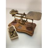 A set of postal style postmaster's letter scales complete with a collection of various weights