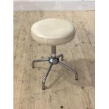 A mid century stool, the circular white leather upholstered rise and fall top raised on a chrome