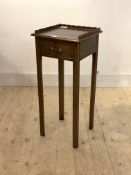 An Edwardian mahogany bedside table, the top with galleried back and sides over one drawer, raised