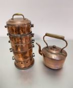 An Edwardian copper brass handled five section steamer cooking pot with pierced base section and