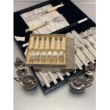 An Epns four-piece condiment set, pastry forks, faux ivory knives and forks etc, faux handled