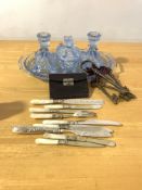 A mixed lot to include; a moulded blue glass tray, pair of candlesticks and a lidded trinket dish;