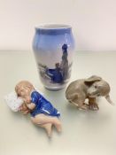 A Royal Copenhagen porcelain baluster vase with figures of a mother and child by the shore,