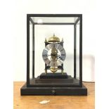 A late 20th century night time lantern style brass skeleton clock, the silvered dial with Roman